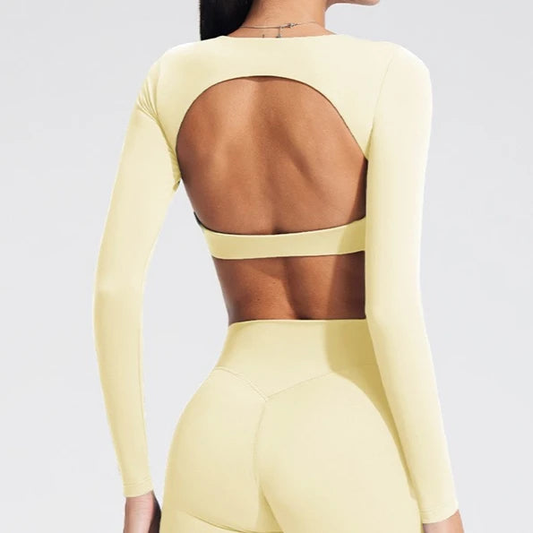 Women's long-sleeved yoga top with built-in breast pads, breathable and comfortable, suitable for gym workouts and fitness. Aurexia off