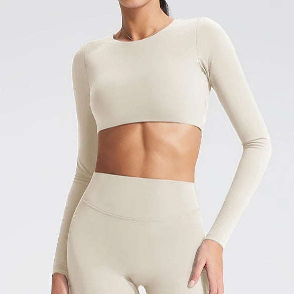 Women's long-sleeved yoga top with built-in breast pads, breathable and comfortable, suitable for gym workouts and fitness. Aurexia off