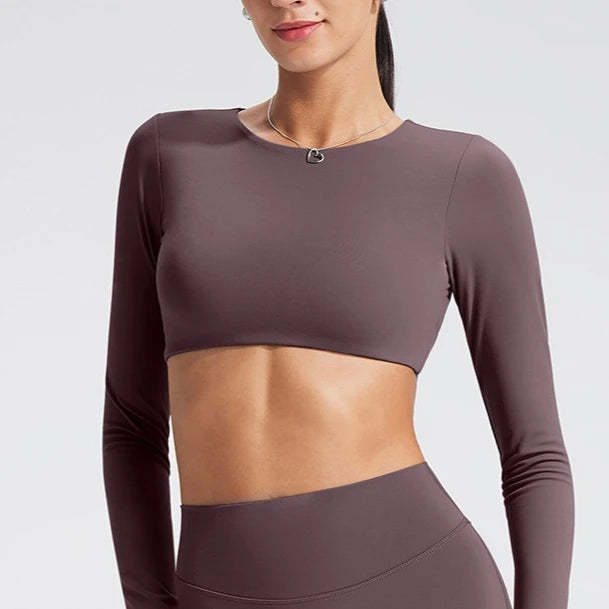 Women's long-sleeved yoga top with built-in breast pads, breathable and comfortable, suitable for gym workouts and fitness. Aurexia off