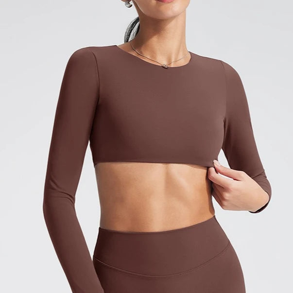 Women's long-sleeved yoga top with built-in breast pads, breathable and comfortable, suitable for gym workouts and fitness. Aurexia off